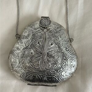 From St Xavier Silver Clutch